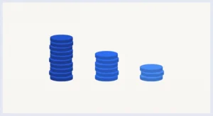 Three stacks of coins representing different tipping etiquette amounts by region
