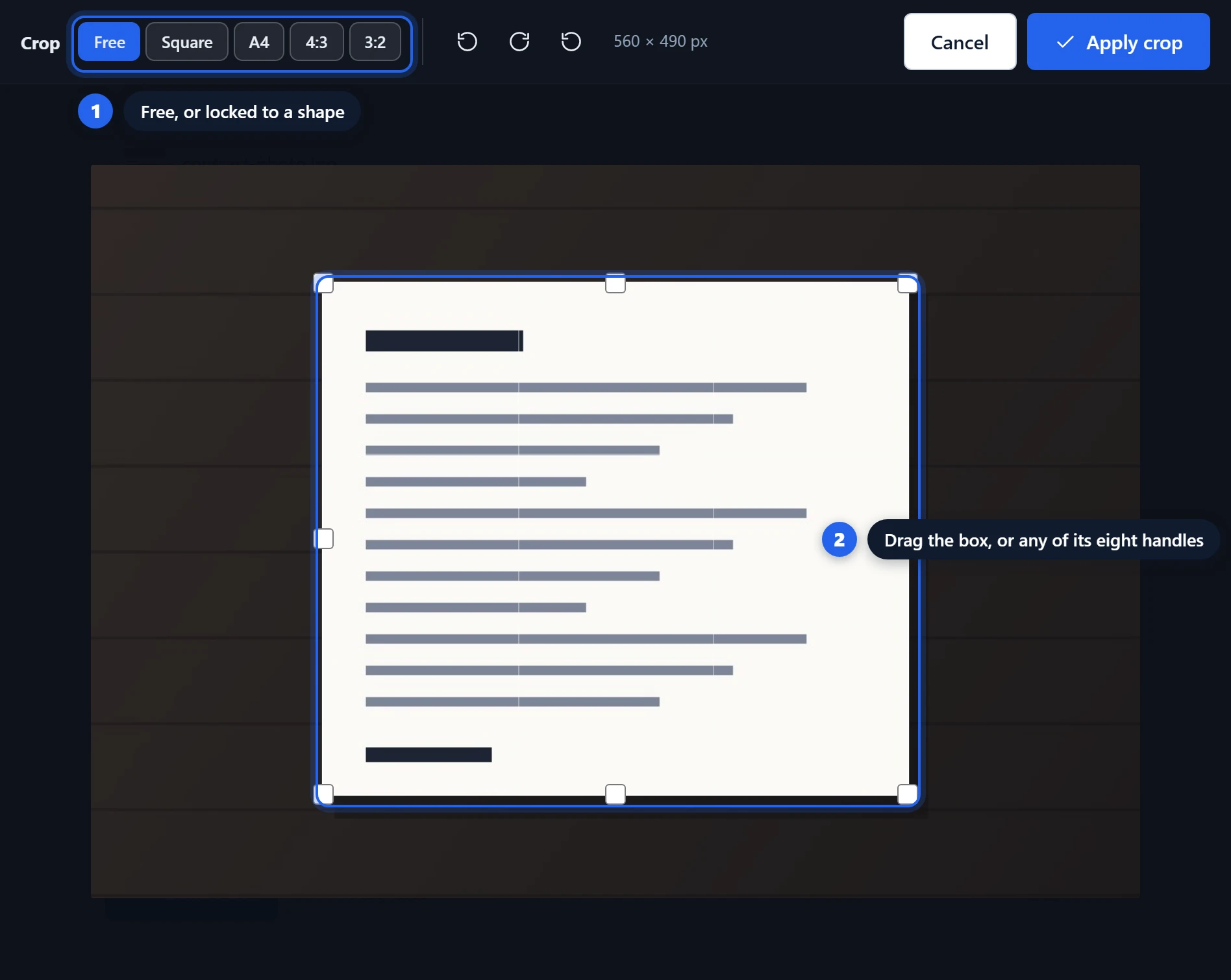 Cropping a photographed document down to the page, with the desk around it dimmed out